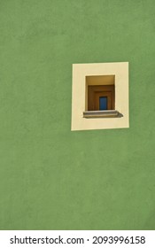 Colorful Facade In Green With Window Detail In A Latin Colonial Building.