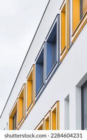 Colorful facade of the object, building. Material of vertical panels. Window cladding.