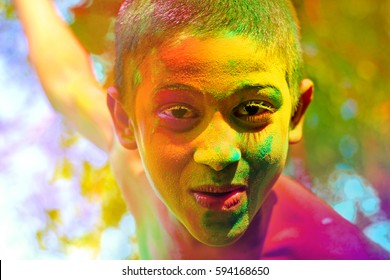 Colorful face of indian child in holi festival