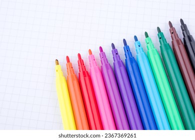 Colorful felt-tip pens on a notebook - Shutterstock ID 2367369261