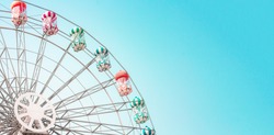 Colorful Ferris Wheel Of The Amusement Park In The Blue Sky  Background.