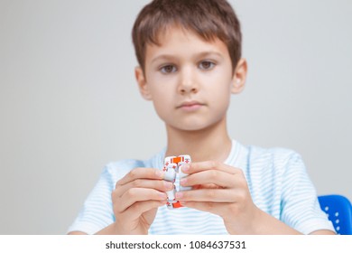 Colorful fingers antistress toy in hands of little boy