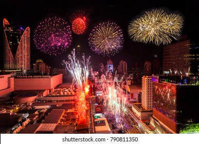 Colorful Firework New Years Celebration in Cityscape of Bangkok Thailand with 3D Projection Mapping on the Building.