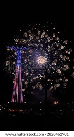Colorful Fireworks Exploding in the Night Sky. Colorful fireworks exploding across the night sky during a festive celebration. Bright bursts of light create a dramatic display against the dark background, symbolizing joy, celebration, holidays, New Year, Independence Day, festivals, and special events. Ideal for backgrounds, greeting cards, advertising, travel, and celebration-themed designs. 