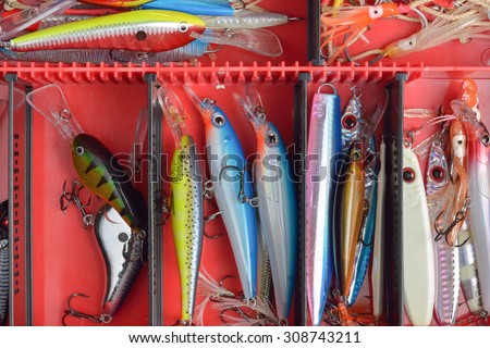 Colorful Fishing Lures on plastic box  desk different fishing baits The fishing equipment.
