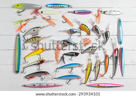 Colorful Fishing Lures on wood desk different fishing baits
