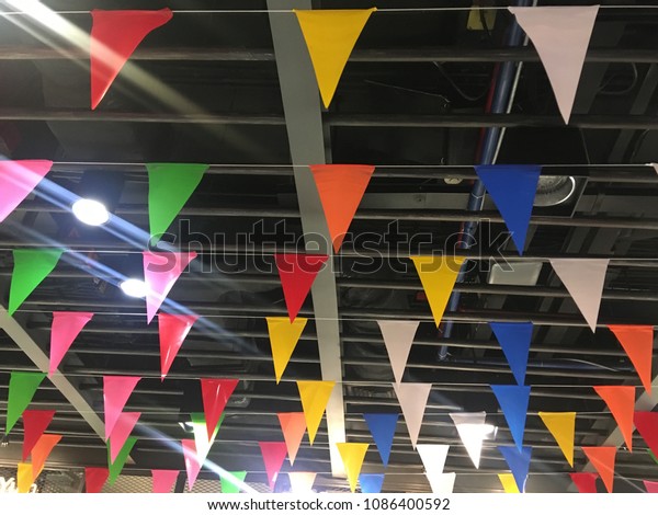 Colorful Flags Hanging On Ceiling Interiors Stock Image