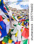 Colorful flags vivid color with old mantra use as tailsman for safety travel on high rock mountain range, Leh Ladakh - India