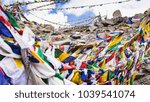 Colorful flags with vivid color use as tailsman for safety travel on high rock mountain range, Leh Ladakh - India