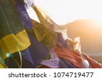 Colorful flags with vivid color use as tailsman for safety travel in tibetan with sunset background