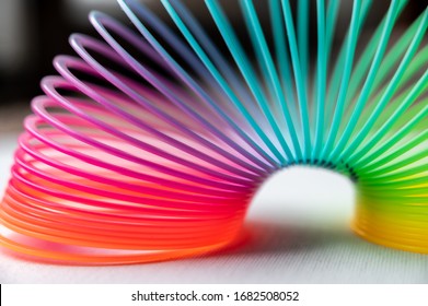 Colorful Flexible Bouncy Plastic Spring Bent Into An Arch