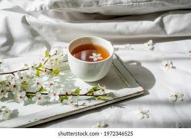 Colorful floral pattern with tea cup. Flat lay.