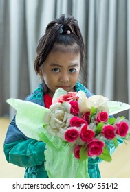 Colorful Flower Bouquet On The Hands Of Adorable Little Pretty Girl, Dressing Fashionable Outfit In Style.  