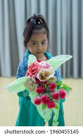 Colorful Flower Bouquet On The Hands Of Adorable Little Pretty Girl, Dressing Fashionable Outfit In Style.  