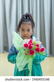 Colorful Flower Bouquet On The Hands Of Adorable Little Pretty Girl, Dressing Fashionable Outfit In Style.  