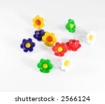 Colorful flower push pins against a soft background