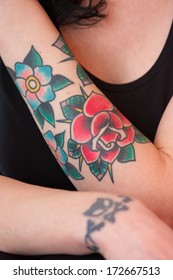 Colorful Flower Tattoo On A Woman's Arm