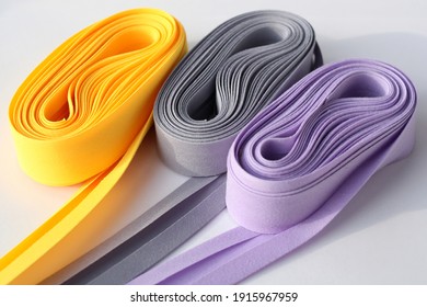 Colorful Fold Bias Tape On White Background. Coil With Bias Binding.Various Colors.