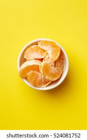 Colorful Food & Drink Still Life Concept. Color Riot Food Photography.  Fresh Fruits & Vegetables On Bright Color Background.  Orange Mandarin Yellow Background.  Closeup. Top View. 