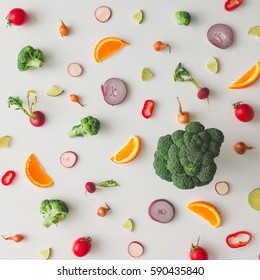 Colorful Food Pattern Made Of Broccoli, Orange, Red Pepper, Onion, Tomatoes And Lime. Flat Lay.