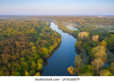 colorful forest and blue river. natural beautiful autumn landscape. drone shot, bird's-eye, aerial view - Shutterstock ID 1476160079