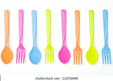 Colorful Fork And Spoon On Isolated White Background
