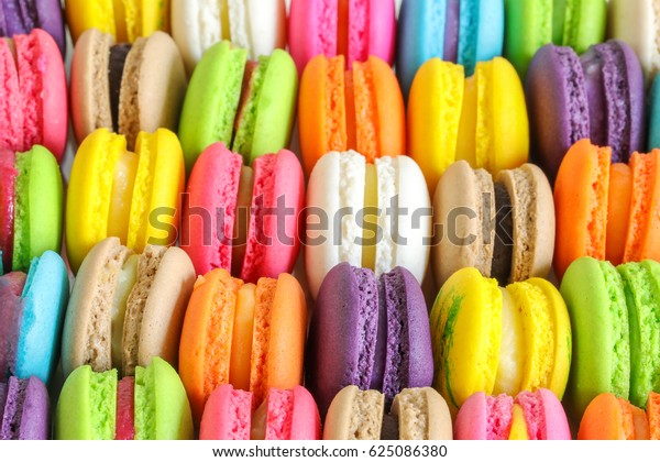 Colorful french macarons background, close\
up.Different colorful macaroons background.Tasty sweet color\
macaron,Bakery concept.Selective\
focus.