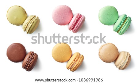Colorful french macarons isolated on white background. Top view. Pastel colors
