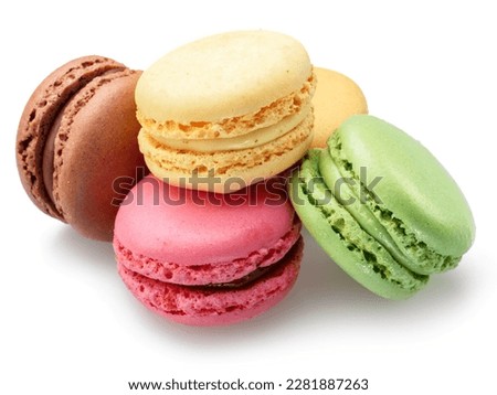 Colorful french macarons isolated on white background.
