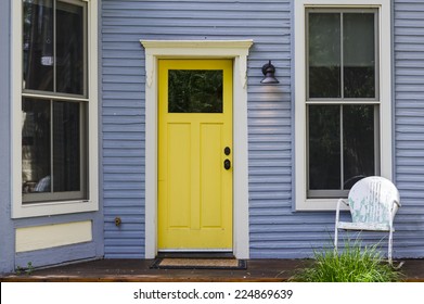 a colorful front door on an old house