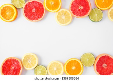 Colorful Fruit Double Border Of Fresh Citrus Slices. Top View, Flay Lay Over A White Background With Copy Space.