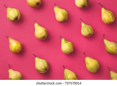 Colorful Fruit Pattern Of Fresh Pears On Pink Background. From Top View