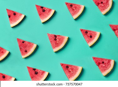 Colorful fruit pattern of fresh watermelon slices on blue background. From top view - Shutterstock ID 737570047