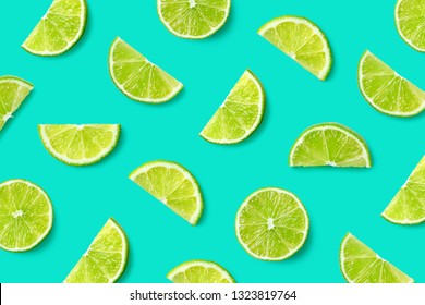 Colorful Fruit Pattern Of Lime Slices On Blue Background. Top View. Flat Lay