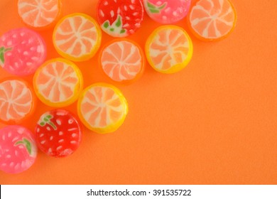 Colorful Fruits Candy On Orange Background