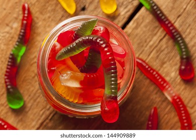 Colorful Fruity Gummy Worm Candy On A Background