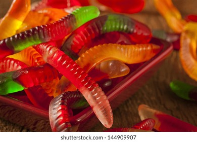 Colorful Fruity Gummy Worm Candy On A Background