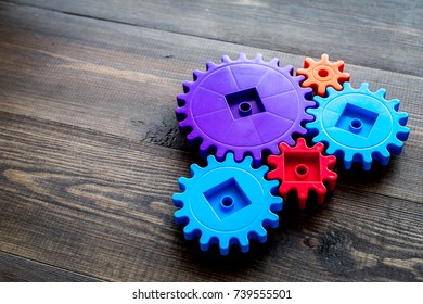 Colorful Gears For Ideal Team Work Technology Wooden Table Background Mock-up