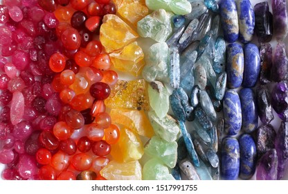 Colorful gemstones seven colors of rainbow mineral stones, reiki healing chakra meditation, gemstones mandala on white background, magic rock quartz with copy space design