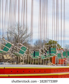 Colorful Giant Carnival Ride Swings Sit Empty. 