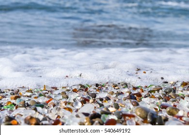 Colorful Glass Pebbles Blanket This Beach In Fort Bragg, California, Photo Taken Mid Day To Get Bright Color In The Rocks And Water