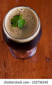 Colorful Green Shamrock Floating On Top Of An Irish Beer