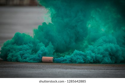 Colorful Green Smoke Bombs Action In Showing