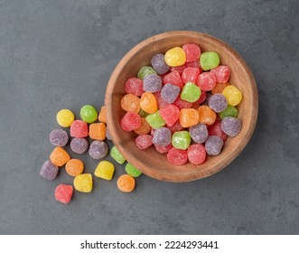 Colorful Gum Drop Candies Over Stone Background.