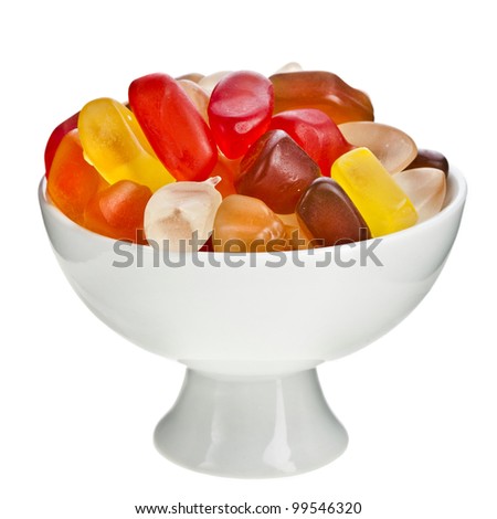 Colorful  gummy bear candies in a bowl isolated on white