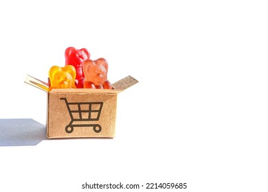 Colorful Gummy Bear Candies In A Small Shipping Box Labeled With A Push Cart Symbol Isolated On White Background.