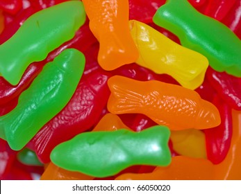 Colorful Gummy Candy Fish Background In Green, Red, Orange And Yellow