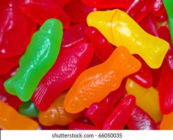 Colorful Gummy Candy Fish Background In Green, Red, Orange And Yellow