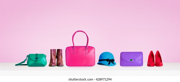 Colorful hand bags,shoes, and hat isolated on pink background. Woman fashion accessories item. Shopping image.  - Shutterstock ID 428971294
