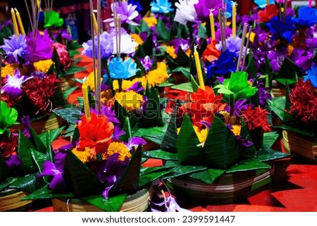 Colorful handmade krathong or floating lantern basket sale thai people into float ritual vessel at river for forgiveness from Khongkha Goddess of water in Loy Krathong festival in Nonthaburi, Thailand
